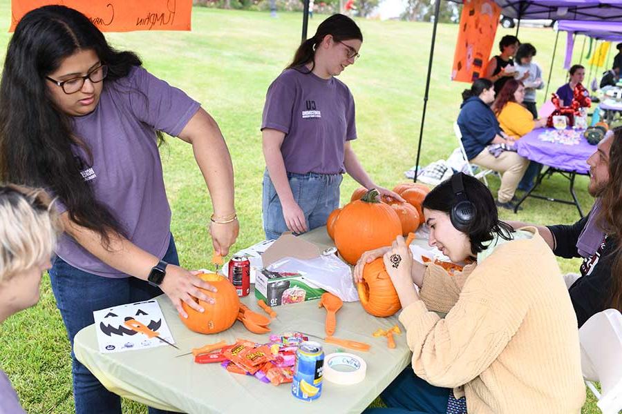 Converse students carve pumpkins during Homecoming week on Halloween.